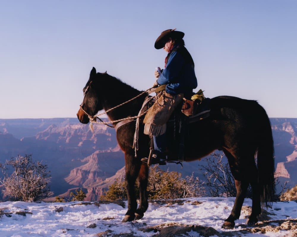 Cowboy riding his horse